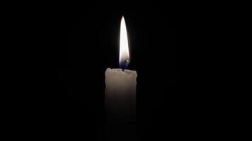 Infinitely flame of a white candle in the night. Candle isolated on a black background. Seamlessly loop footage. video