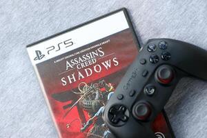 KYIV, UKRAINE - JUNE 26, 2024 Assassin's Creed Shadows PS5 game disc box for console gaming. Popular game disc photo