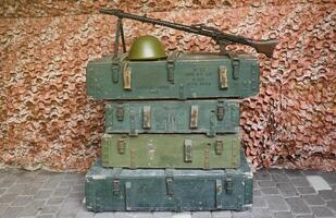 Soviet army ammunition stack of green crates with russian names of ammo type and category photo