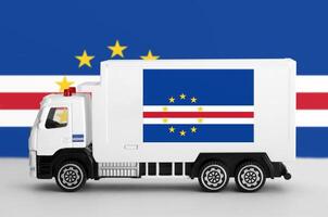 Cabo verde flag depicted on side wall of white delivery van. Shipping and local delivery concept photo