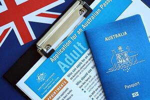 KYIV, UKRAINE - JULY 10, 2024 Application for an Australian passport for adult blank forms on table. Department of foreign affairs and Trade photo