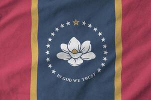 Mississippi new US state flag depicted on folded wavy fabric of old cloth photo