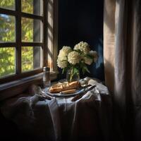 French baguette. Half a stick of butter. Butter knife. Antique plate. An opened tin of anchovies. Wooden table. Window with white curtains. Hydrangeas flower bouquet in a glass vase photo