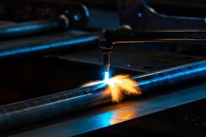 Heating up of metal construction with acetylene and oxygen burner in process of flame straightening with visible red colour of heated metal photo