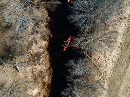 Kayaking on river early spring, view from above photo