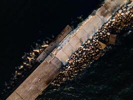 Aerial photo of a pathway leading to a lighthouse