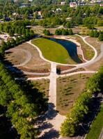 New redesigned Victory park in Riga, Latvia with a pond and pedestrian walks photo