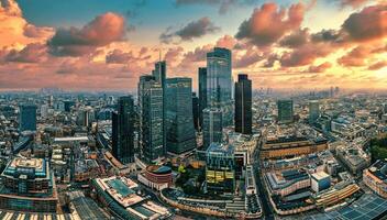 Aerial Drone View of London's Financial Center at Sunset, a Glowing Skyline of Modernity and Prosperity photo