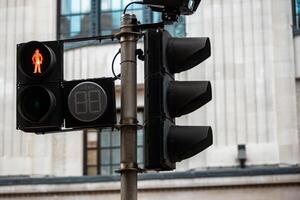 Close Up of Red Traffic Light Signaling No Crossing Allowed at Intersection. Restricted Pedestrian Movement photo