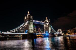 London Tower Bridge at Night. One of London's most famous bridges and must see landmarks in London. photo