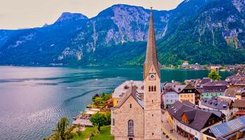 Close up ov Hallstatt Lutheran Church in Beautiful mountain village Hallstatt in the Austrian Alps, Salzkammergut region, Hallstatt, Austria. Aerial drone view. photo