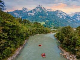 Adventurous River Rafting in the Austrian Alps Join the Thrilling Journey on the Rapids with Boats and Brave Souls photo