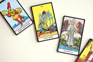 KYIV, UKRAINE - JULY 10, 2024 Tarot minor and major arcana cards of Rider Waite esoteric deck. Many tarot cards for fortune telling and esoteric actions photo