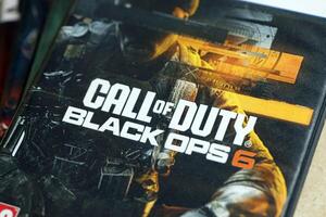 KYIV, UKRAINE - JUNE 26, 2024 Call of Duty Black Ops 6 PS5 game disc box for console gaming. Popular game disc photo