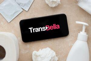 KYIV, UKRAINE - JANUARY 23, 2024 TransBella adult content website logo on display of iPhone 12 Pro photo