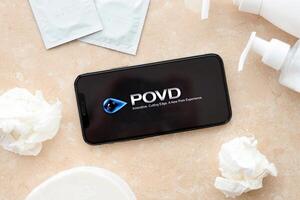 KYIV, UKRAINE - JANUARY 23, 2024 POVD adult content website logo on display of iPhone 12 Pro photo