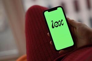 KYIV, UKRAINE - FEBRUARY 23, 2024 Lex logo of famous dating website or app on iPhone display photo