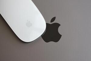 KYIV, UKRAINE - NOVEMBER 27, 2023 Apple Magic Mouse 3rd generation lies with grey MacBook 2021 photo