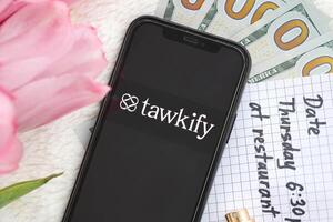 KYIV, UKRAINE - FEBRUARY 23, 2024 Tawkify logo of famous dating website or app on iPhone display photo