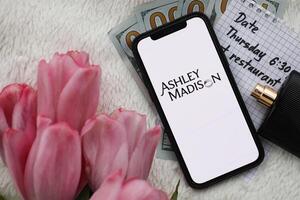 KYIV, UKRAINE - FEBRUARY 23, 2024 Ashley Madison logo of famous dating website or app on iPhone display photo