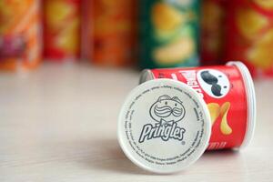 KYIV, UKRAINE - FEBRUARY 27, 2024 Pringles original potato chips on white background photo