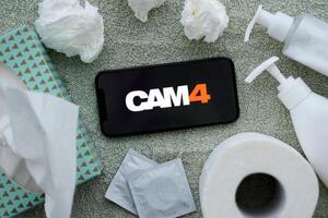 KYIV, UKRAINE - JANUARY 23, 2024 Cam4 adult content website logo on display of iPhone 12 Pro photo