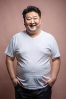 Korean Obese Middle-Aged, Sophisticated, Distinctive, White Oversized T-Shirt With Blank Space, Suitable For Design Mockups And Print Applications for Portfolio, Travel, Events photo