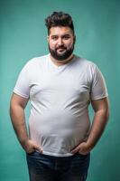 Turkish Obese Adult, Sleek, Artistic, White Oversized T-Shirt With Blank Space, Mock Up T Shirt Concept for Retail, Non-profit, Creative Agency photo