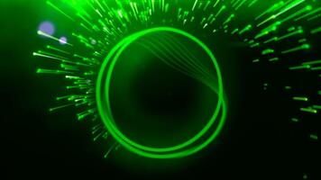 Green background. Motion.A bright multicolored laser ring in animation next to which a salute is flying. video