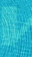 Water from a pool in close-up. Scene. Close-up of colorful swimming pool underwater background video