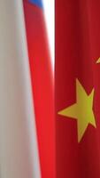 Russian and Chinese flags. Two flags of Russia and China, symbolizing the cooperation between the two powers video