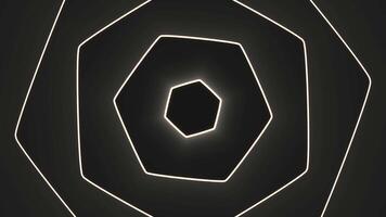 Hypnotic hexagons appearing. Motion. Geometric hexagons appear in waves on black background. Glowing geometric shapes with wave rotations video
