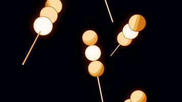 Orange lollipops. Design.A black background on which orange candies on a stick fly in abstraction in different directions. video