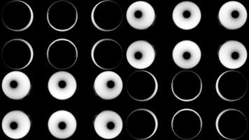 Flashing round lights on black background. Design. Background of light bulbs with black dots. Slow flashing round disco-style light bulbs video
