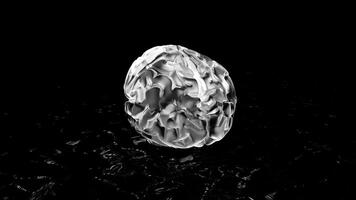 Black background. Motion.A silvery illuminated silhouette of the brain made in animation that rotates around. video
