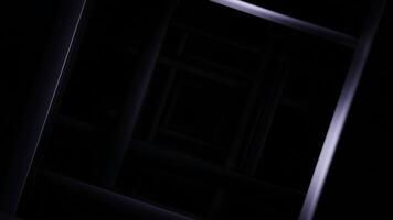 Dark square tunnel with light shadows. Design. Square tunnel with moving lines and light illusion of deception. Light shadows with illusion in square dark tunnel video