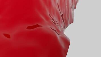 Close up of red rippling red jelly substance on a white background. Design. Abstract hardened jelly wobbling. video