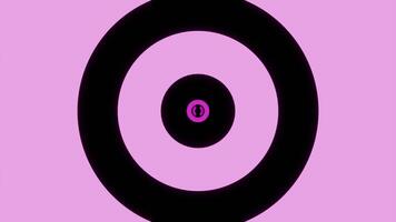 Light green and pink background . Design.Black large circles of different sizes move and narrow in abstraction. video