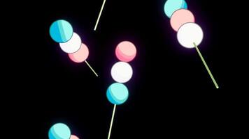 Abstract spherical shaped marshmallows on a skewers falling down isolated on a black background. Design. Delicious marshmallows falling down. video