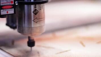 Concept of production and woodworking. Motion. Cutting wood with a CNC milling machine at the factory. video