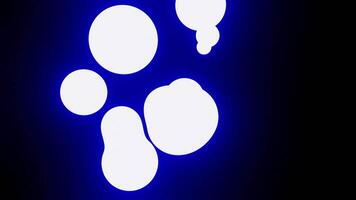 Abstract spheres of green and and purple spheres pulsating on a black background. Design. Glowing balls stick together and break apart. video