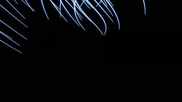 Abstract moving and curving narrow fibers on a black background. Design. Twisted narrow stripes like tentacles. video