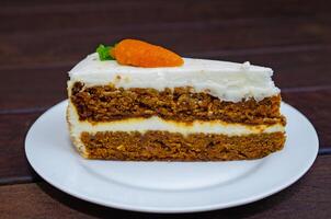 Carrot sponge cake with cream and walnuts photo