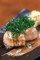 Sushi Joe Crispy Kale, salmon roll, cream cheese, fried kale and chives on plate photo