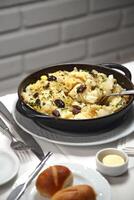 Cod with Pereira Ignacio, classic Portuguese recipe with port cod, onion, parsley, egg and olive oil photo