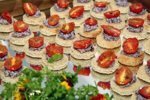 canape with black olives and tomato confit photo
