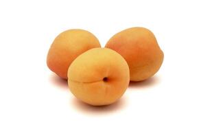 group of whole peaches on white background photo