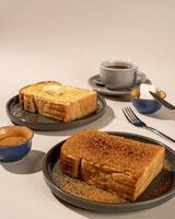 Roti Bakar is a typical grilled Indonesian sandwich, consisting of two slices of bread and filling, suitable to be served with Americano coffee. photo
