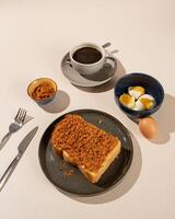 Roti Bakar is a typical grilled Indonesian sandwich, consisting of two slices of bread served with eggs and coffee photo