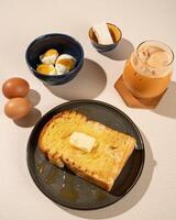 Roti Bakar is a typical grilled Indonesian sandwich, consisting of two slices of bread and filling, served with Teh Tarik and boiled egg. photo